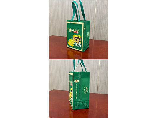 Fully automatic non-woven cross-cutting and ironing bag-making machine with online handle attachings