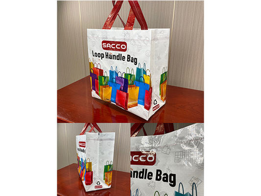 Fully automatic non-woven cross-cutting and ironing bag-making machine with online handle attachings